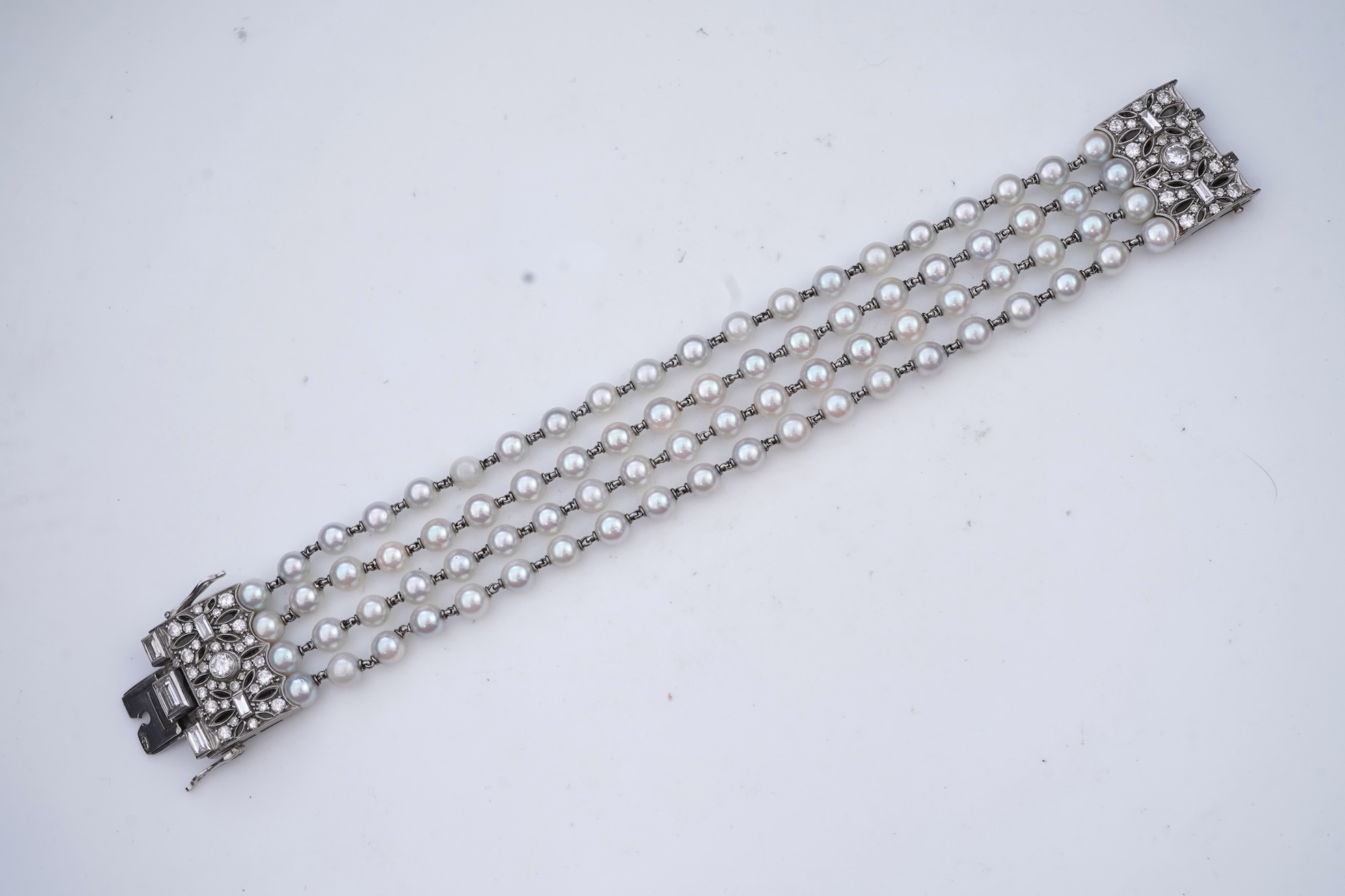 A cultured pearl and diamond bracelet